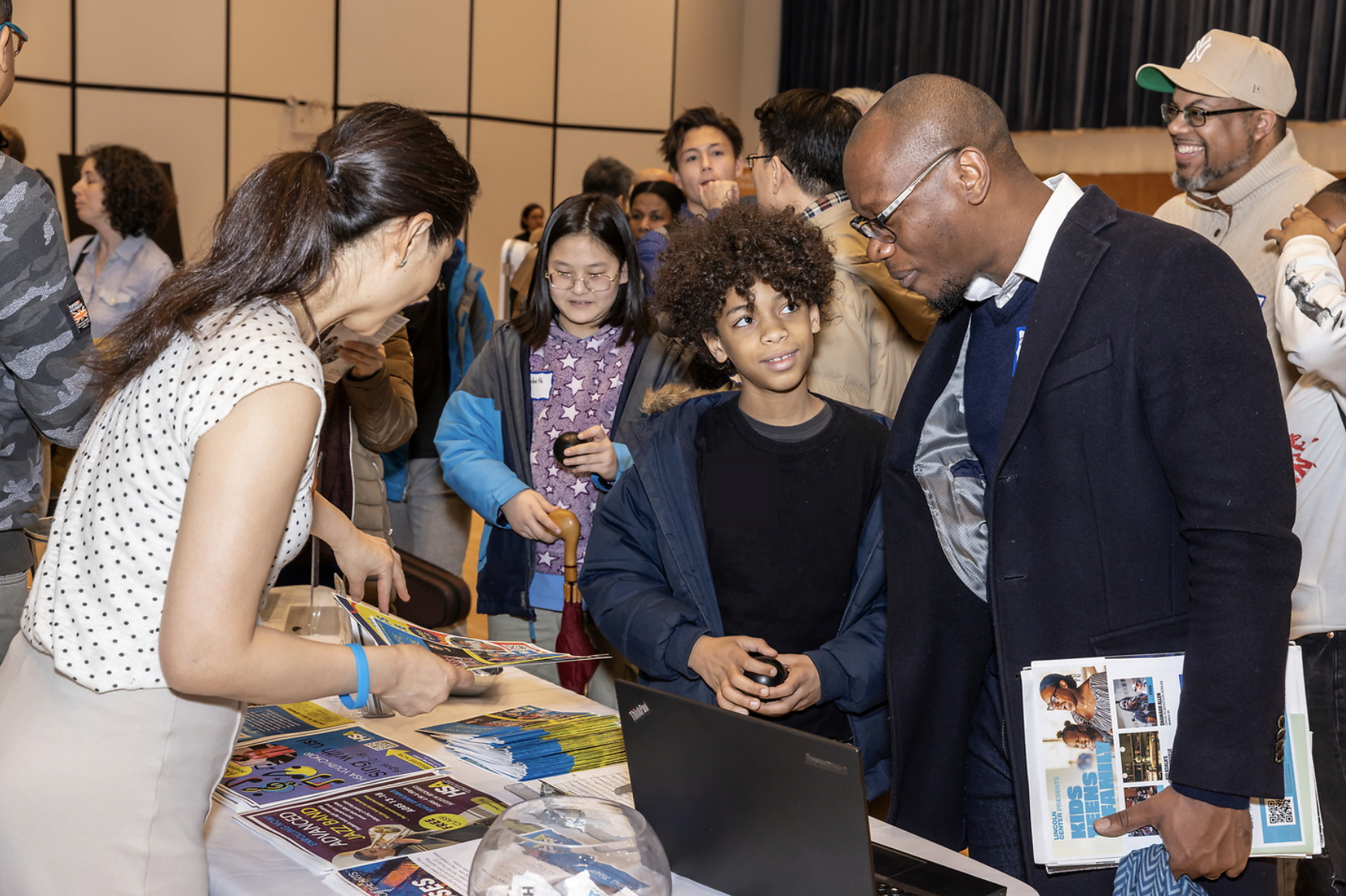 Students and parents browsing at information table